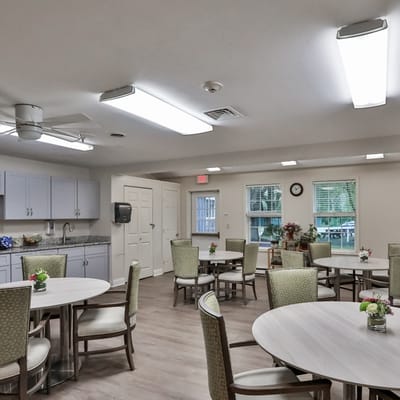 Bright common area with tables and chairs