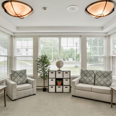 Bright common area with seating and natural light