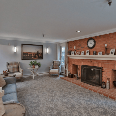 Cozy interior common area with a fireplace
