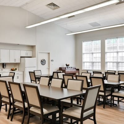 Bright dining room with set tables and chairs