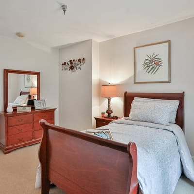Cozy private room with wooden furniture and decor