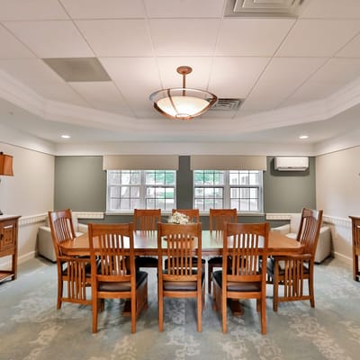 Bright common area with dining table and chairs