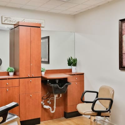 Hair salon area with a chair and sink