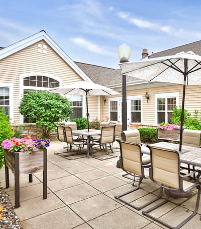 Outdoor seating area with tables and umbrellas