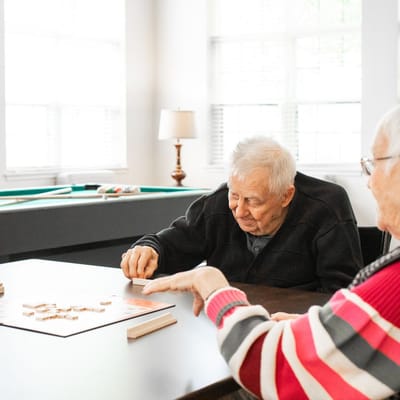 Residents playing a game in a common area