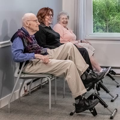 Three residents sitting together in a common area