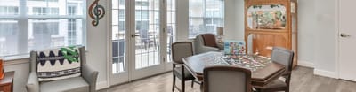 Common area with residents playing a puzzle game