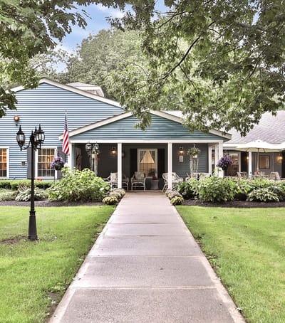 Exterior view of a senior living facility with a pathway