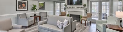 Bright common area with seating and artwork on the walls
