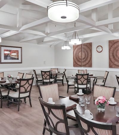 Dining room with tables set for residents