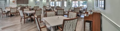 Interior view of a dining area with tables and chairs