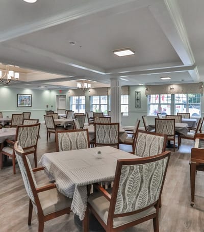 Bright and airy dining room with tables and chairs