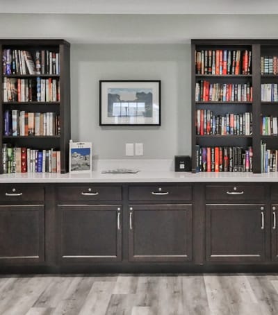 Interior view of a library area with bookshelves.