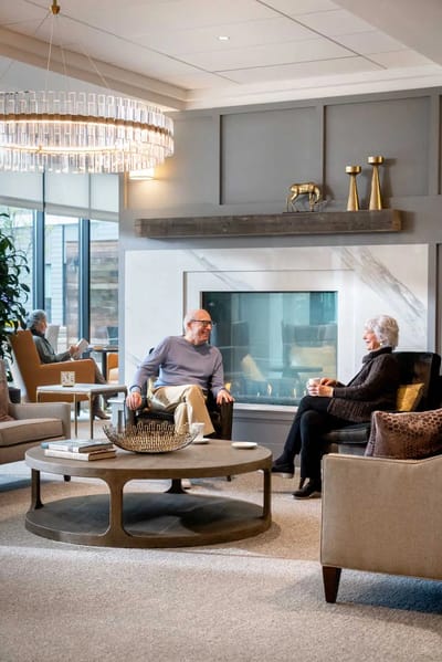 Residents enjoying conversation in a cozy common area