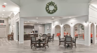 Bright common area with dining tables and decor