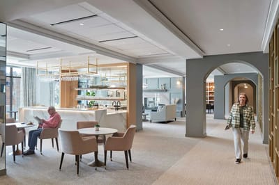 Residents in a bright common area with modern decor