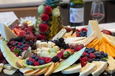 A visually appealing cheese and fruit platter