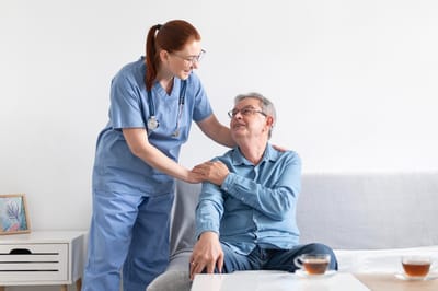 Nurse interacting with a resident in a cozy common area