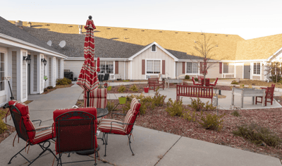 Outdoor seating area with red and white umbrellas