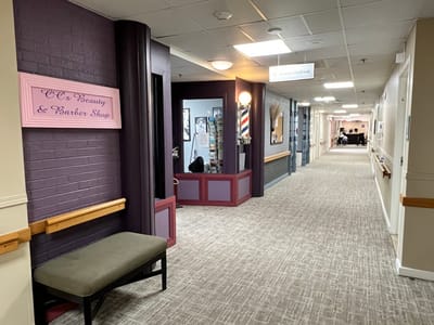 Interior corridor with beauty and barber shop signage