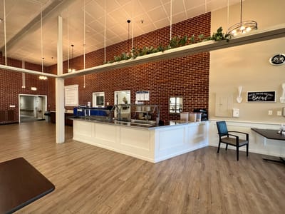 Bright dining area with serving station and seating