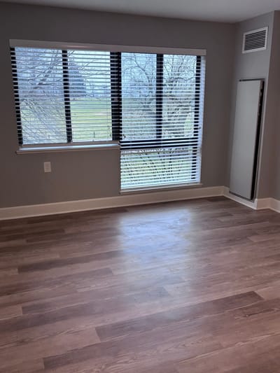 An interior view of a resident room with windows