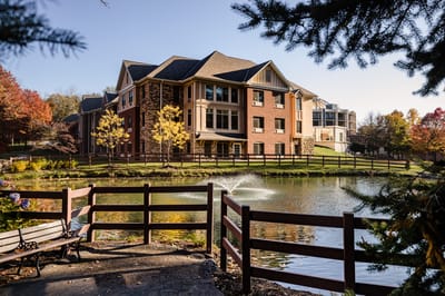 Exterior view of the building by the pond at Ohio Living Rockynol