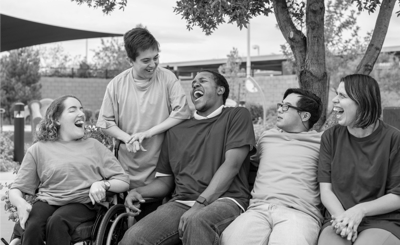 Residents enjoying time outdoors and laughing together.