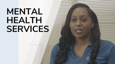 Staff member discussing mental health services