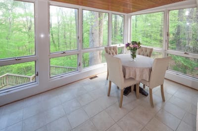 Interior sunroom with a table and flowers