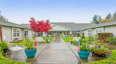 Well-maintained outdoor area with seating and landscaping.