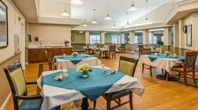 Dining area with tables and floral centerpieces