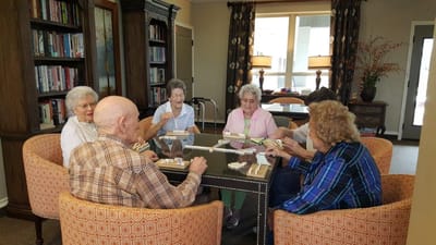 Residents engaged in a group activity in the common area.