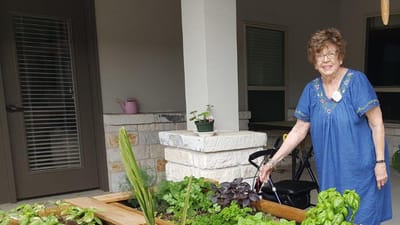 Resident tending to a garden.