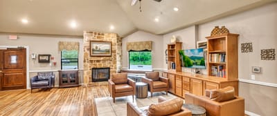 Comfortable lounge area with seating and television.