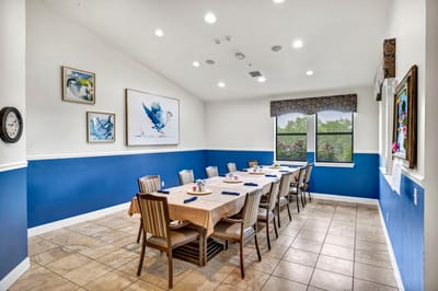 Dining area set for a meal with blue accents