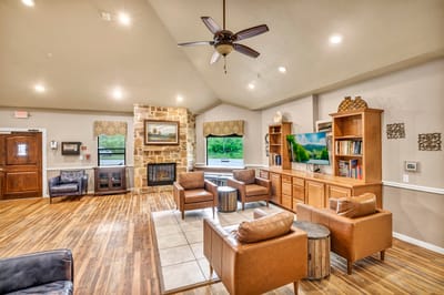 Interior common area featuring cozy seating and fireplace.
