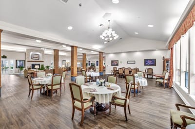 Elegant dining room setup with tables and chairs