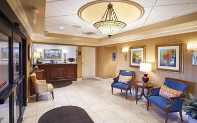 Common area with seating and artwork in a senior living facility