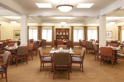 Dining room set for a meal with prepared tables