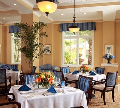 Elegant dining room with tables set for a meal