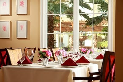 Elegant dining area with flowers and table settings