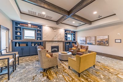 Cozy common area with seating and bookshelves