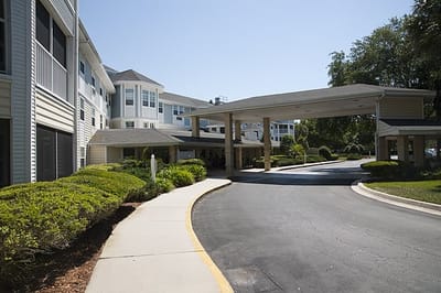 Entrance of a senior living facility with landscaped drive