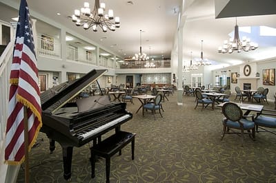 Interior dining area with tables and a piano