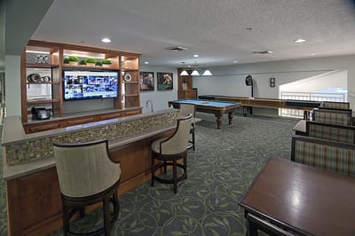 Bright common area with game tables and seating