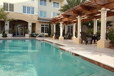 Pool area with seating and pergola