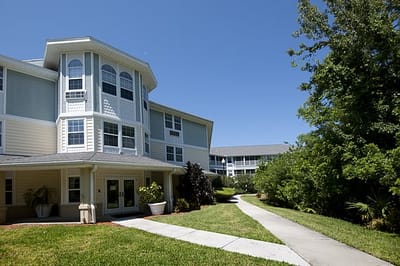 Exterior view of a senior living facility with pathways