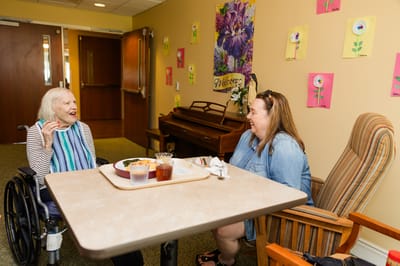 Residents enjoying a meal in a common area