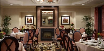 Elegant dining room with tables set for a meal